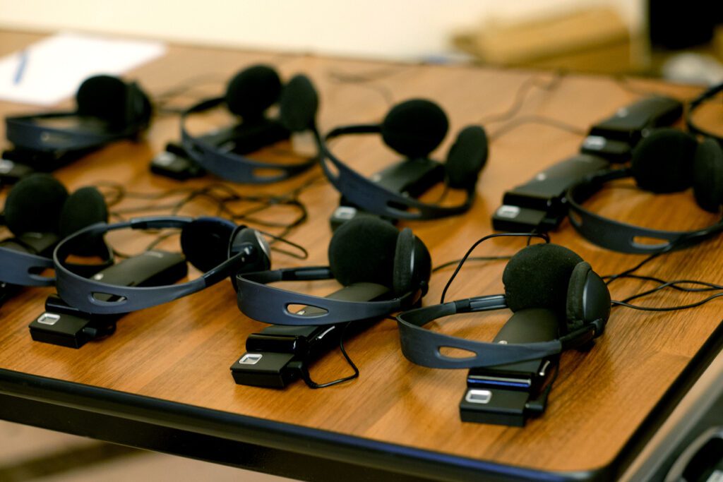 Headphones and receivers for participants to listen to interpreting.