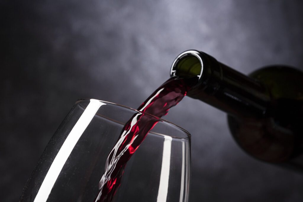 Wine being poured into a glass, illustrating the subject-matter expertise of our Food Translation Services.